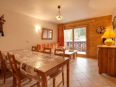 a dining room with a table and chairs at Appartement 7 pers, proche des pistes, balcon - FR-1-642-40 in Morillon
