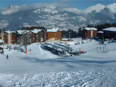 a group of people sitting in chairs in the snow at Appartement duplex rénové 6p, expo sud - FR-1-642-56 in Morillon