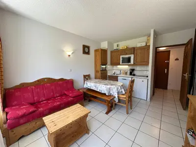 a red maple leaf ornament on a wooden table at Appartement cosy 6 pers avec balcon en montagne - FR-1-642-53 in Morillon