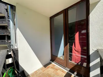 a resort in the snow with mountains in the background at Confortable appartement à Morillon 1100 pour 5 pers, TV, animaux admis - FR-1-642-45 in Morillon