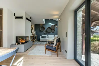 a living room with a fireplace in a house at Chalet Alouette in Chamonix-Mont-Blanc