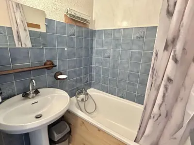 a bathroom with a sink and a toilet and a tub at Studio avec alcôve et cabine, 4 couchages à Demi-Quartier, parking inclus - FR-1-597-115 in Demi-Quartier
