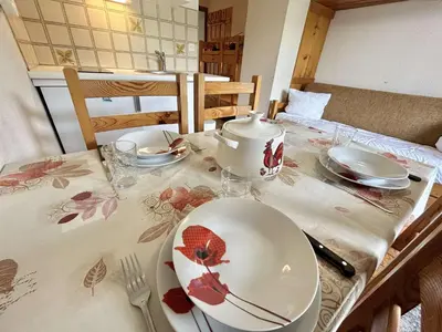a table with a plate and a tea pot on it at Studio avec alcôve et cabine, 4 couchages à Demi-Quartier, parking inclus - FR-1-597-115 in Demi-Quartier