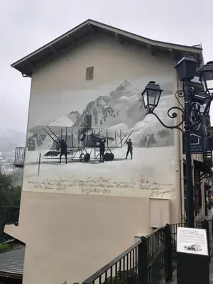 a mural on the side of a building with skiers at DRYADES SAINT GERVAIS in Saint-Gervais-les-Bains
