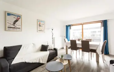 a living room with a couch and a table at DRYADES SAINT GERVAIS in Saint-Gervais-les-Bains