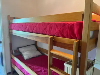 a couple of bunk beds in a room at Studio chaleureux avec balcon au centre de Samoëns - FR-1-624-83 in Samoëns