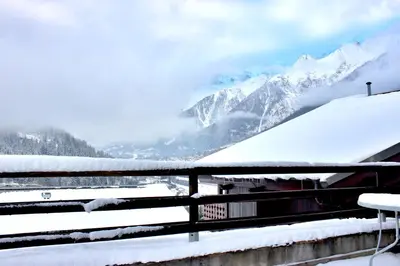 a view of a snowy mountain from a fence at Les Grand Balcon - 2ch - 2 balcons - Randonnée - Escalade - Lac des Chavants in Les Houches