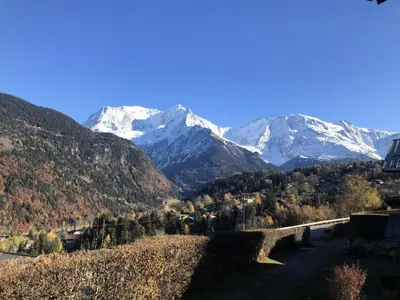 a view of a mountain range with snow covered mountains at Chalet Le Bionnassay - Chalet le Bionnassay MAE-8134 in Saint-Gervais-les-Bains