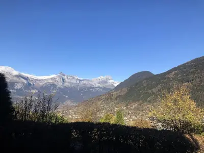 a view of a mountain range with snow covered mountains at Chalet Le Bionnassay - Chalet le Bionnassay MAE-8134 in Saint-Gervais-les-Bains