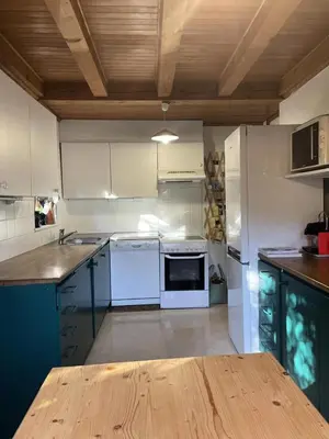 a kitchen with white appliances and a wooden ceiling at Chalet Le Bionnassay - Chalet le Bionnassay MAE-8134 in Saint-Gervais-les-Bains