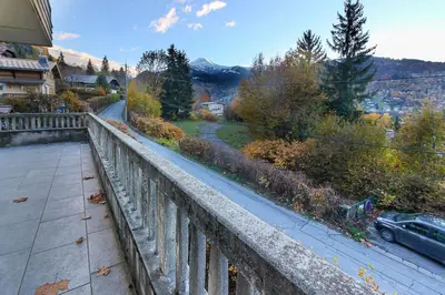 a view of a road from a balcony with a car at Le Petit Eloi in Saint-Gervais-les-Bains