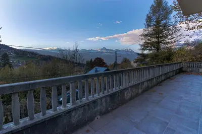 a balcony with a fence and a view of the mountains at Le Petit Eloi in Saint-Gervais-les-Bains