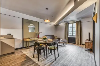 a dining room and kitchen with a table and chairs at Majestic Broadway - 4 star apartment with spectacular views in Chamonix-Mont-Blanc
