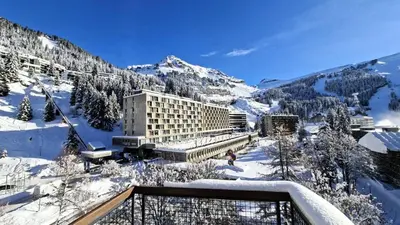 a view of a hotel in the snow at Résidence Betelgeuse - Appartement confortable · Proche des pistes et des commerces · Balcon MAE-7376 in Flaine
