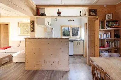 a kitchen and living room in a tiny house at Le Petite Chalet Tourmente in Chamonix-Mont-Blanc