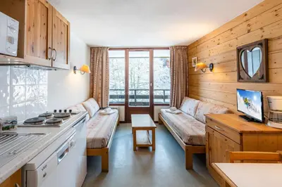 a room with a kitchen and a living room at Vacancéole - Résidence Grand Morillon in Morillon
