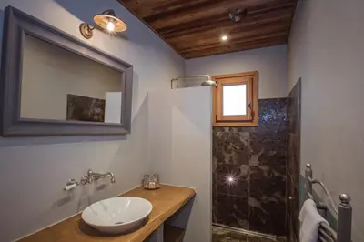 a bathroom with a sink and a shower at Paccard Locations Chamonix in Chamonix-Mont-Blanc