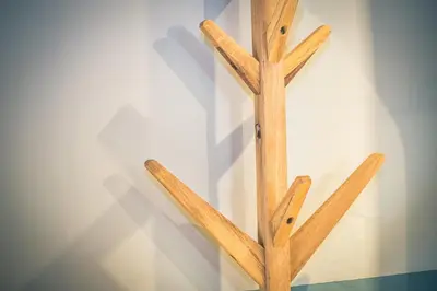 a group of wooden sticks leaning against a wall at Paccard Locations Chamonix in Chamonix-Mont-Blanc