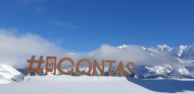 a sign in the snow with mountains in the background at Chalet Keller in Les Contamines-Montjoie