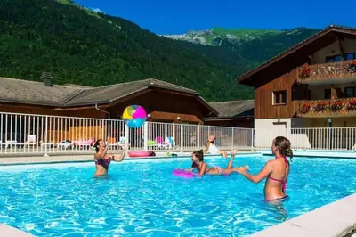 a group of women in a swimming pool at Bel Appartement en résidence avec piscines in Samoëns