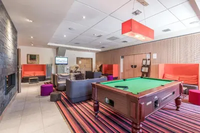 a billiard room with a pool table in it at Appartement Premium à Flaine, altitude 1740 m, 8 à 10 personnes, au pied des pistes, piscine, jacuzzi, sauna, hammam et salle de sport in Flaine