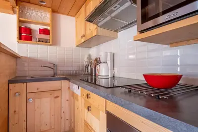 a kitchen with a red bowl on the counter at Bel Apt Near The Slopes Argentiere in Chamonix-Mont-Blanc