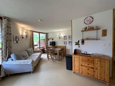 a living room with a couch and a table at Appartement spacieux 6 pers. proche jardin d'enfants - FR-1-642-58 in Morillon
