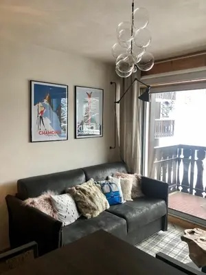 a living room with a couch and a window at Studio Le 4122 - Chamonix centre Clos du Savoy in Chamonix-Mont-Blanc