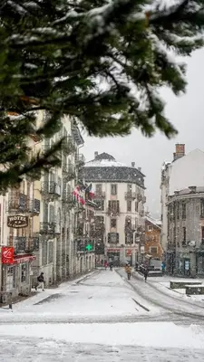 a snowy city street with buildings in the snow at Studio Le 4122 - Chamonix centre Clos du Savoy in Chamonix-Mont-Blanc