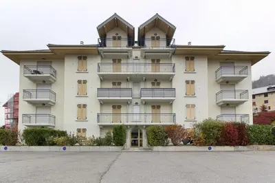 a large white building with balconies on it at Appartement L'Armancette - Proche centre et Bettex in Saint-Gervais-les-Bains