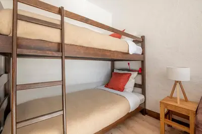 a couple of bunk beds in a room at Nice Studio With Balcony In Chamonix in Chamonix-Mont-Blanc