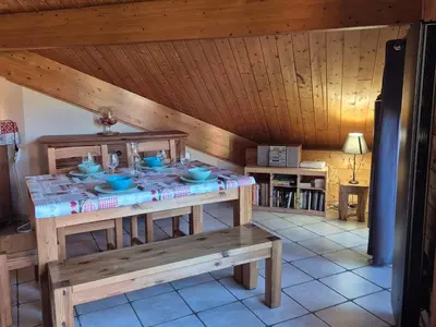 a room with a table with bowls on it at Confortable T2 proche télécabine Grand Massif - FR-1-624-41 in Samoëns