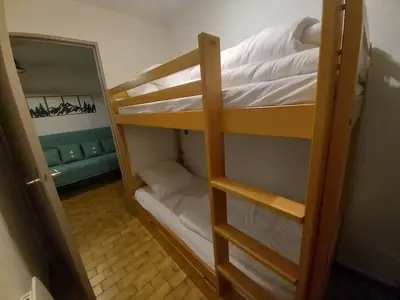 a couple of bunk beds in a room at Samoëns - Studio Les Espaces in Samoëns