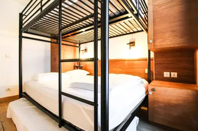 a couple of bunk beds in a room at Newly redecorated 2-bed ski-in ski-out family apartment in Flaine