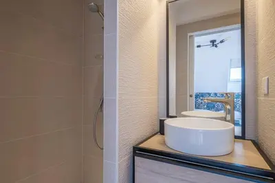a bathroom with a sink and a mirror at L'Appart 52, magnifique duplex en plein coeur de Chamonix-Mont-Blanc in Chamonix-Mont-Blanc