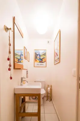 a bathroom with a sink and a toilet at Comme un chalet, appartement à la montagne in Saint-Gervais-les-Bains