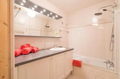 a bathroom with a sink and a shower and a tub at Comme un chalet, appartement à la montagne in Saint-Gervais-les-Bains