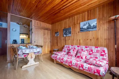 a living room with a couch and a table at Apartment With Balcony Close To The Ski Slopes in Chamonix-Mont-Blanc
