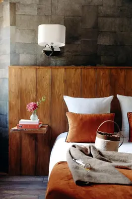 a bedroom with a bed with a lamp on it at Auberge des Gorges - Restaurant Gastronomique & Chambres in Servoz