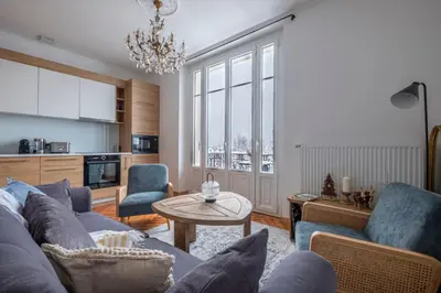 a living room with a couch and a table at Nice Apt With Balcony In Chamomix in Chamonix-Mont-Blanc