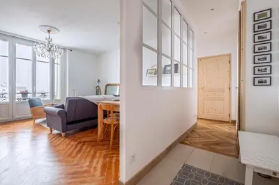 a living room with a table and a dining room at Nice Apt With Balcony In Chamomix in Chamonix-Mont-Blanc