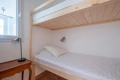 a bedroom with a bunk bed with a window at Nice Apt With Balcony In Chamomix in Chamonix-Mont-Blanc