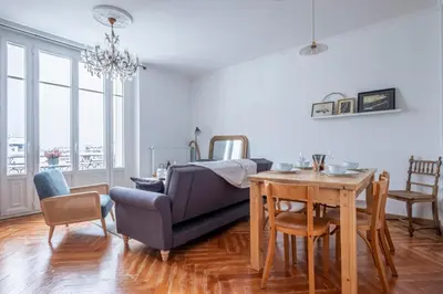 a living room with a couch and a table at Nice Apt With Balcony In Chamomix in Chamonix-Mont-Blanc