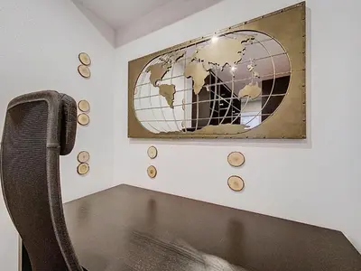 a room with a picture of a globe on the wall at Chamonix Hyper centre . terrasse vue mont blanc . parking in Chamonix-Mont-Blanc