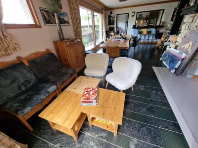 a living room with a couch and a table at Chalet du Vernay in Saint-Gervais-les-Bains