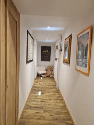 a hallway with a teddy bear and a teddy bear sidx sidx at Chalet du Vernay in Saint-Gervais-les-Bains