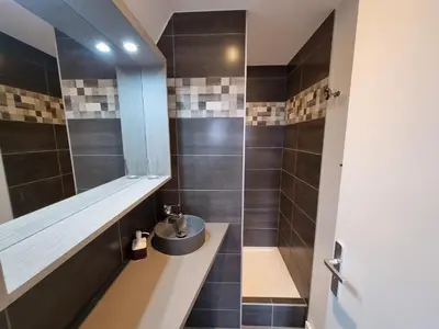 a bathroom with a sink and a shower at Chalet du Vernay in Saint-Gervais-les-Bains