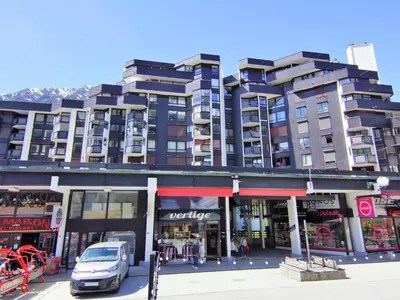 a large building with a car parked in front of it at Apartment Le Beau Site by Interhome in Chamonix-Mont-Blanc