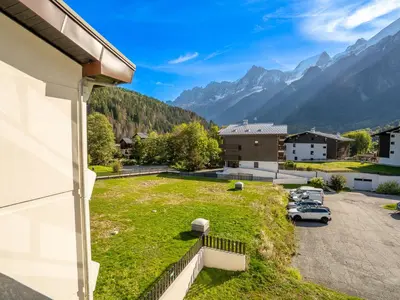 a view from the balcony of a house with a parking lot at Apartment Le Prarion by Interhome in Les Houches