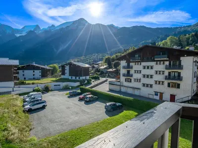 a view of a town with cars parked in a parking lot at Apartment Le Prarion by Interhome in Les Houches